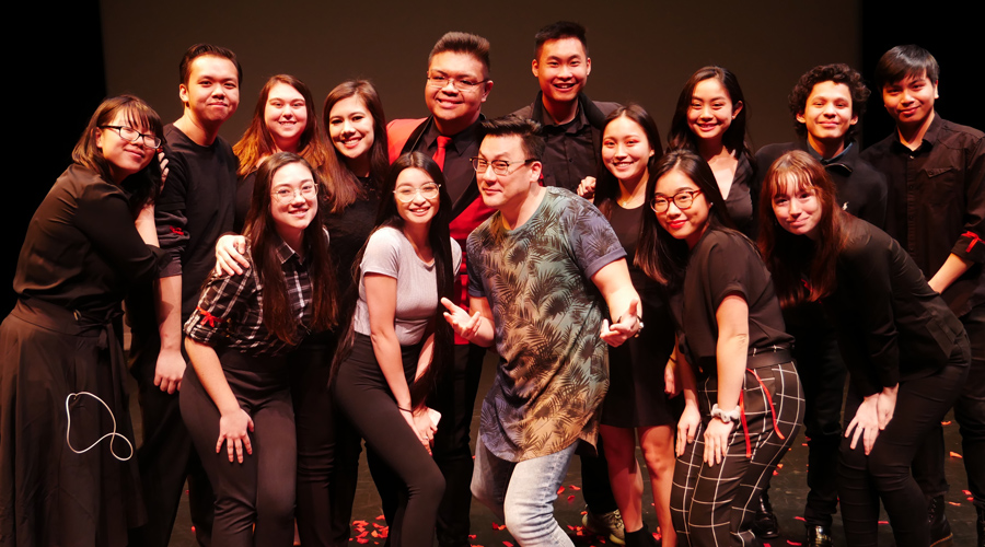 Suffolk student Brandon poses with the Asian American Student Association at the Modern Theatre.