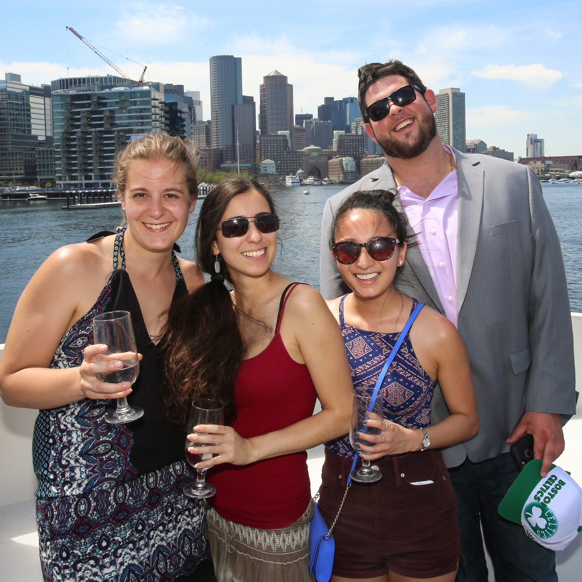 Casey posing with friends during the Senior Week Boston Harbor boat cruise.