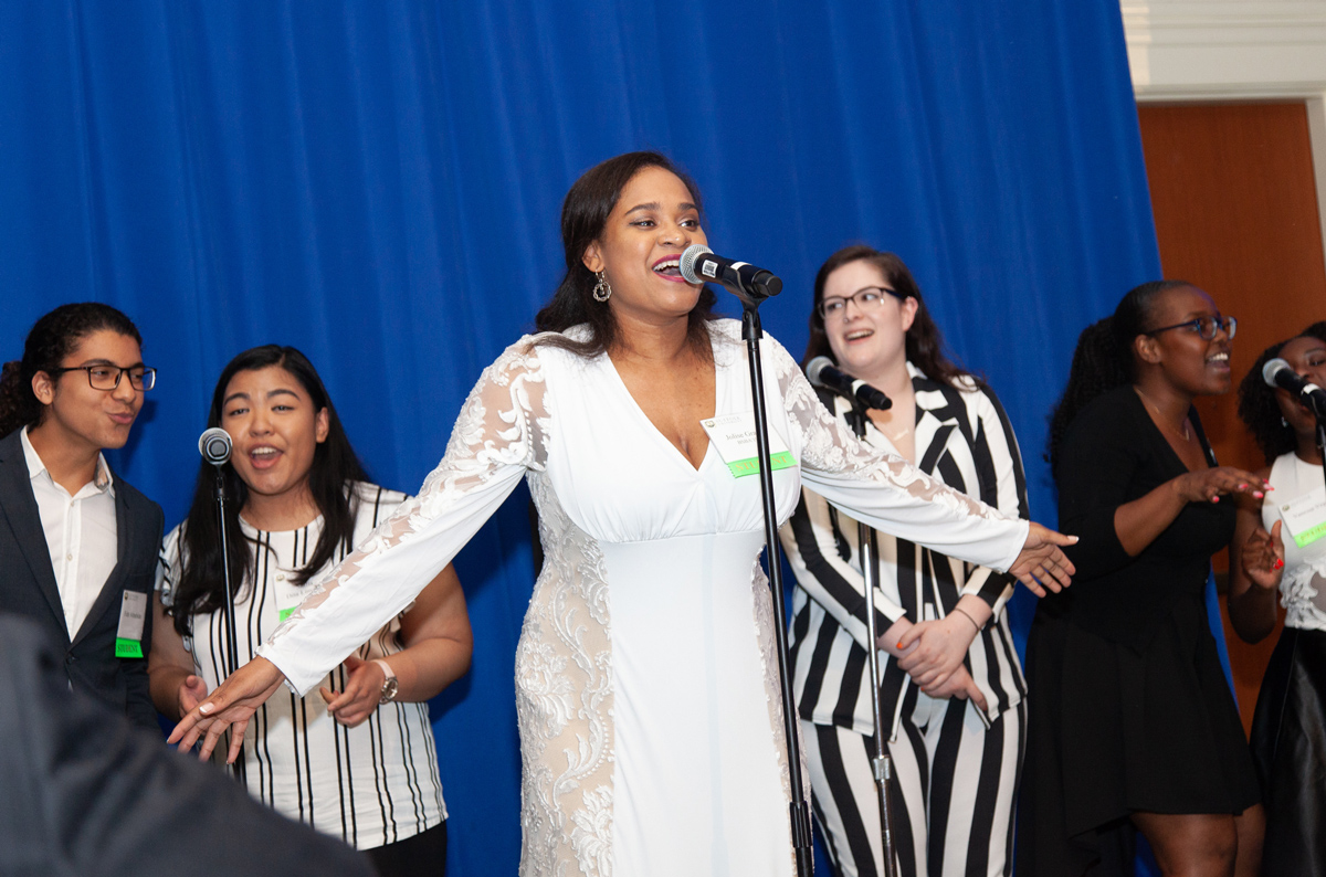Jo'lise hits a note during a performance by her a capella group Soulfully Versed at Commencement Eve Dinner.