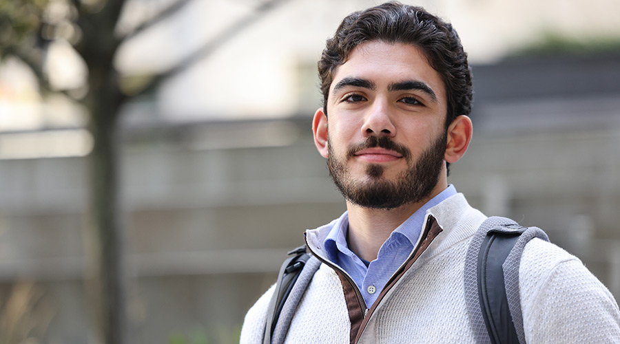 Suffolk student Domenico poses for a portrait.