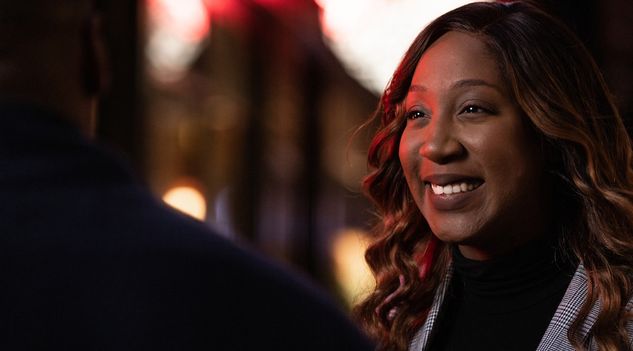 Suffolk student Stacy Daniel talks with a friend in Downtown Crossing.