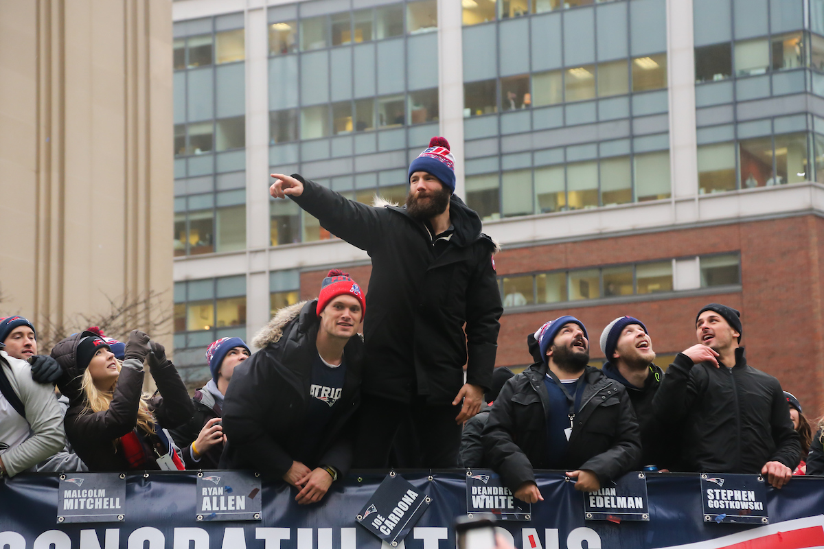 Wide receiver Julian Edelman points into the crowd from atop a Duck boat during the Patriots Super Bowl victory parade.