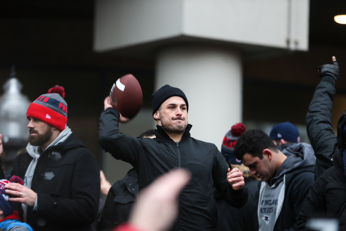 Wide receiver Danny Amendola prepares to throw a football into the crowds along Tremont Street during the Patriots Super Bowl victory parade.
