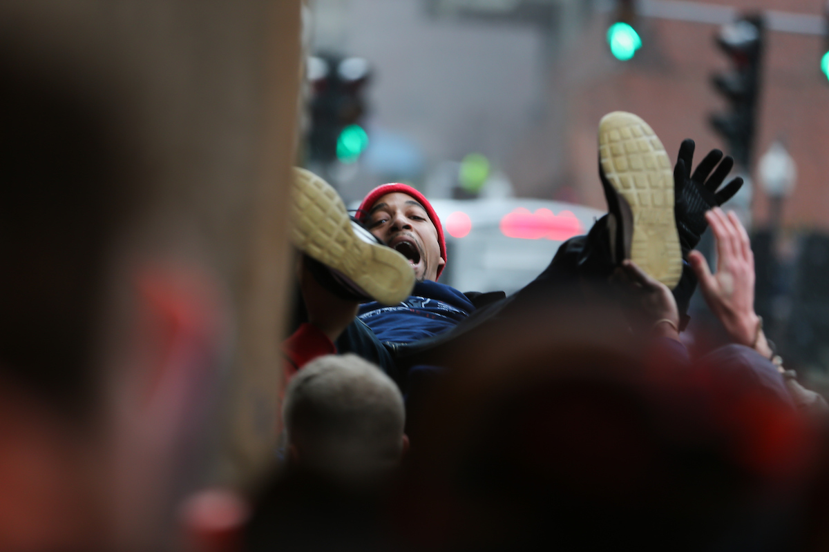 The New England Patriots Super Bowl victory parade draws thousands of spectators to Suffolk's downtown Boston campus.