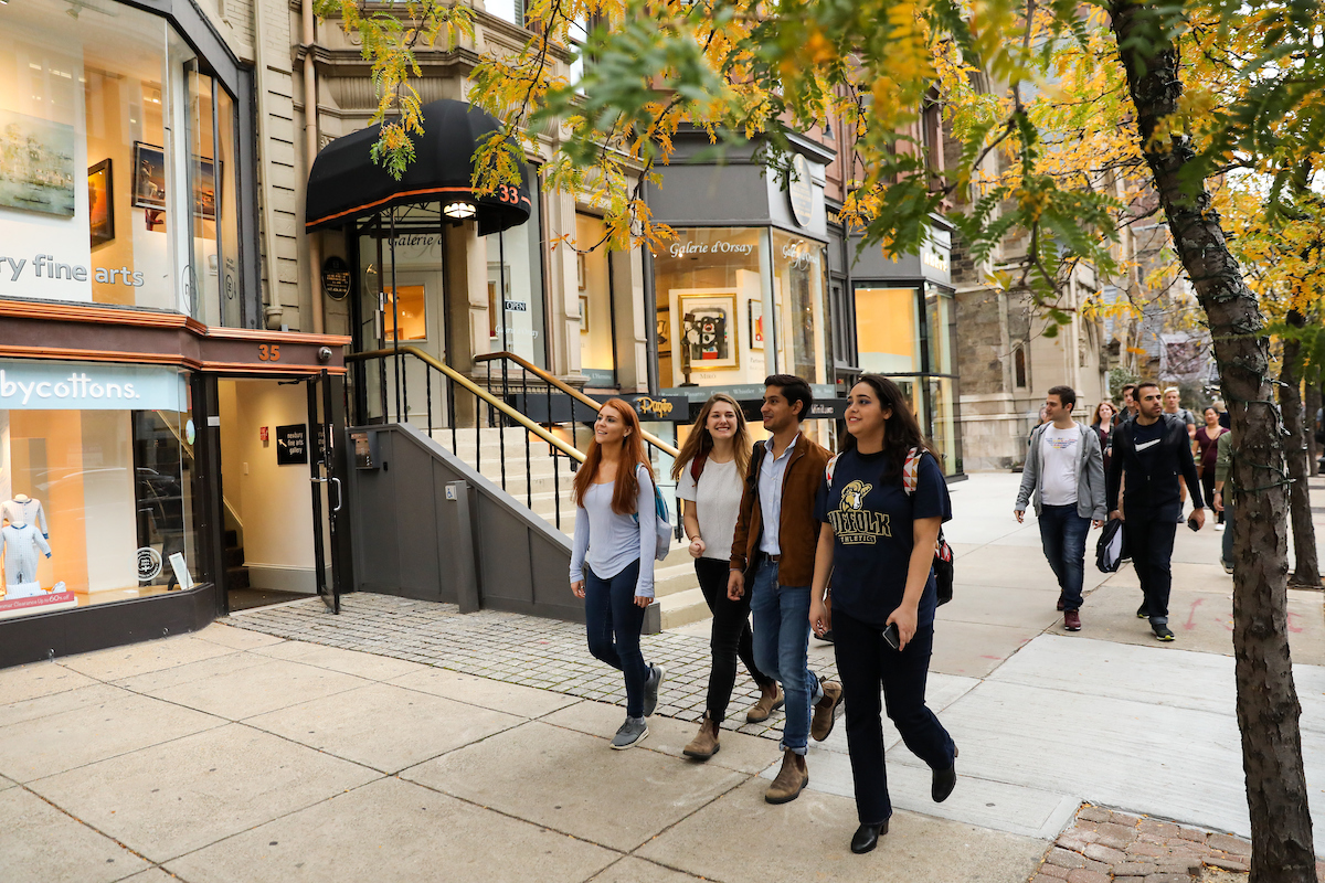 Suffolk students walking along Newbury Street in Boston's Back Bay neighborhood.