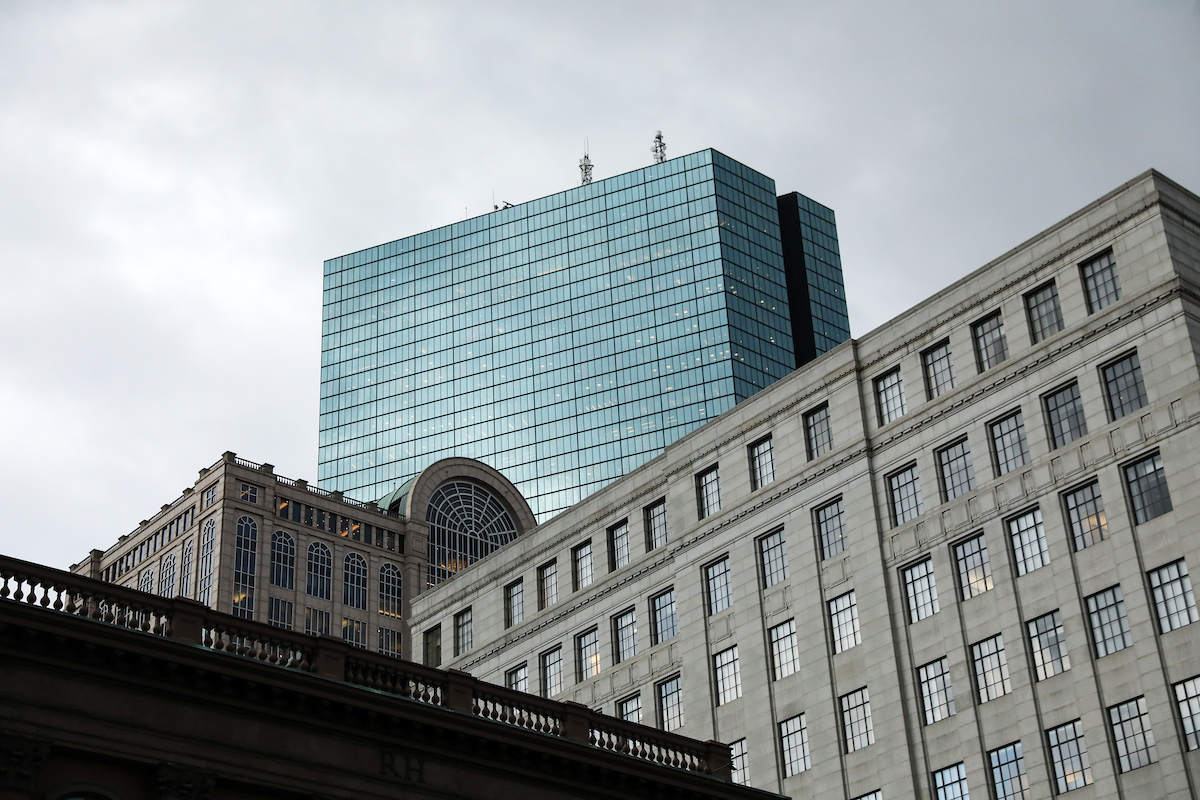The Hancock Tower peaking over the buildings in Boston's Back Bay neighborhood.