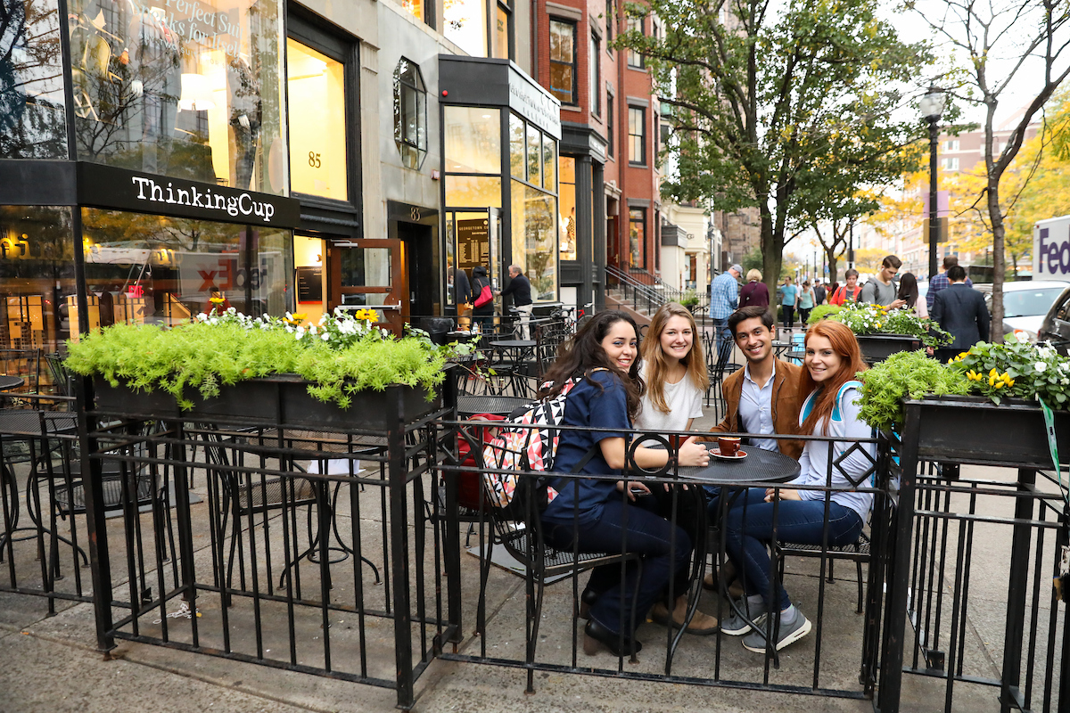 Suffolk students pose for a photo while having coffee at Thinking Cup on Newbury Street.