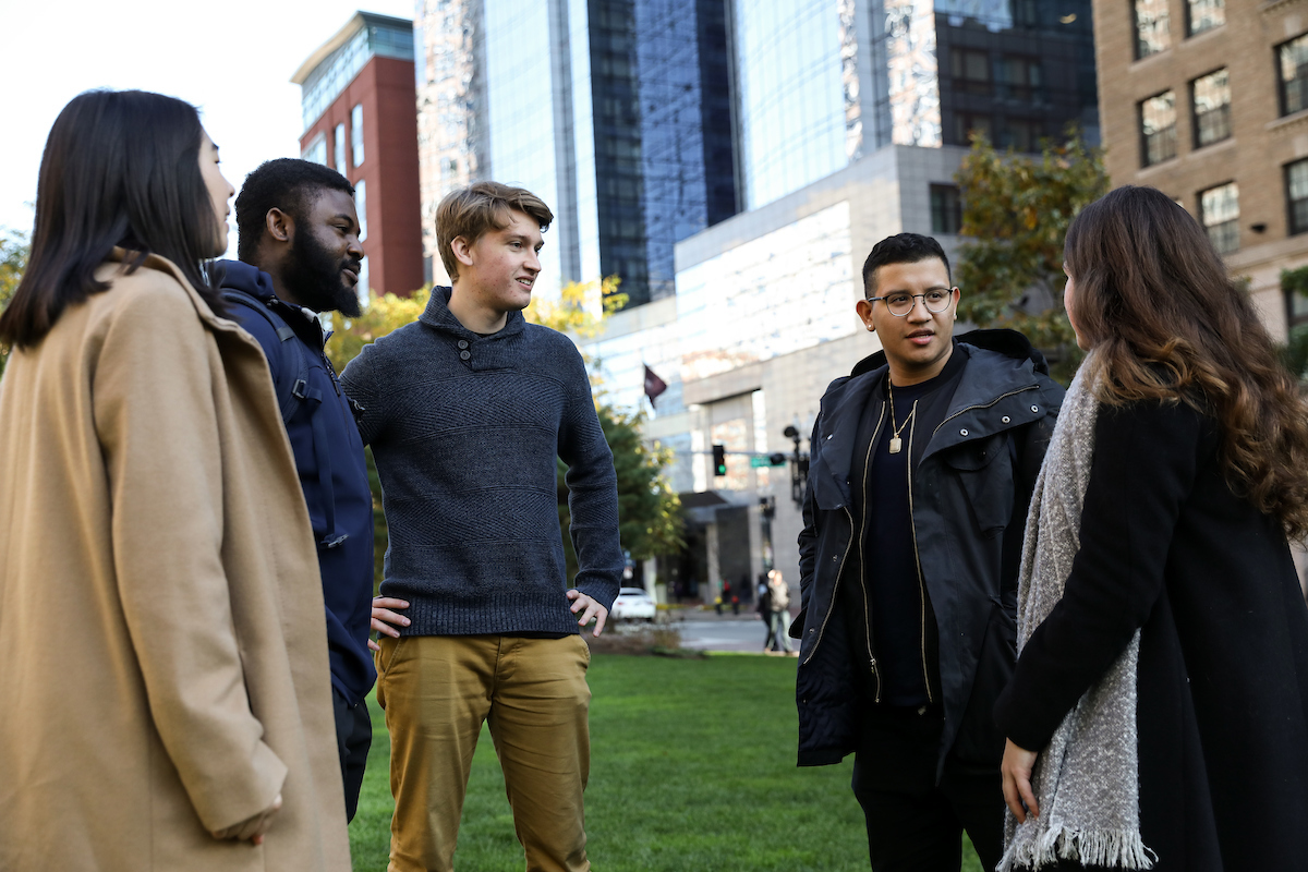 Suffolk students walk around in Boston's Rose Kennedy Greenway area.