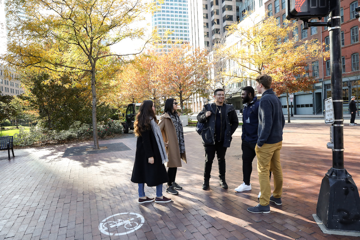 Suffolk students walk around in Boston's Rose Kennedy Greenway area.