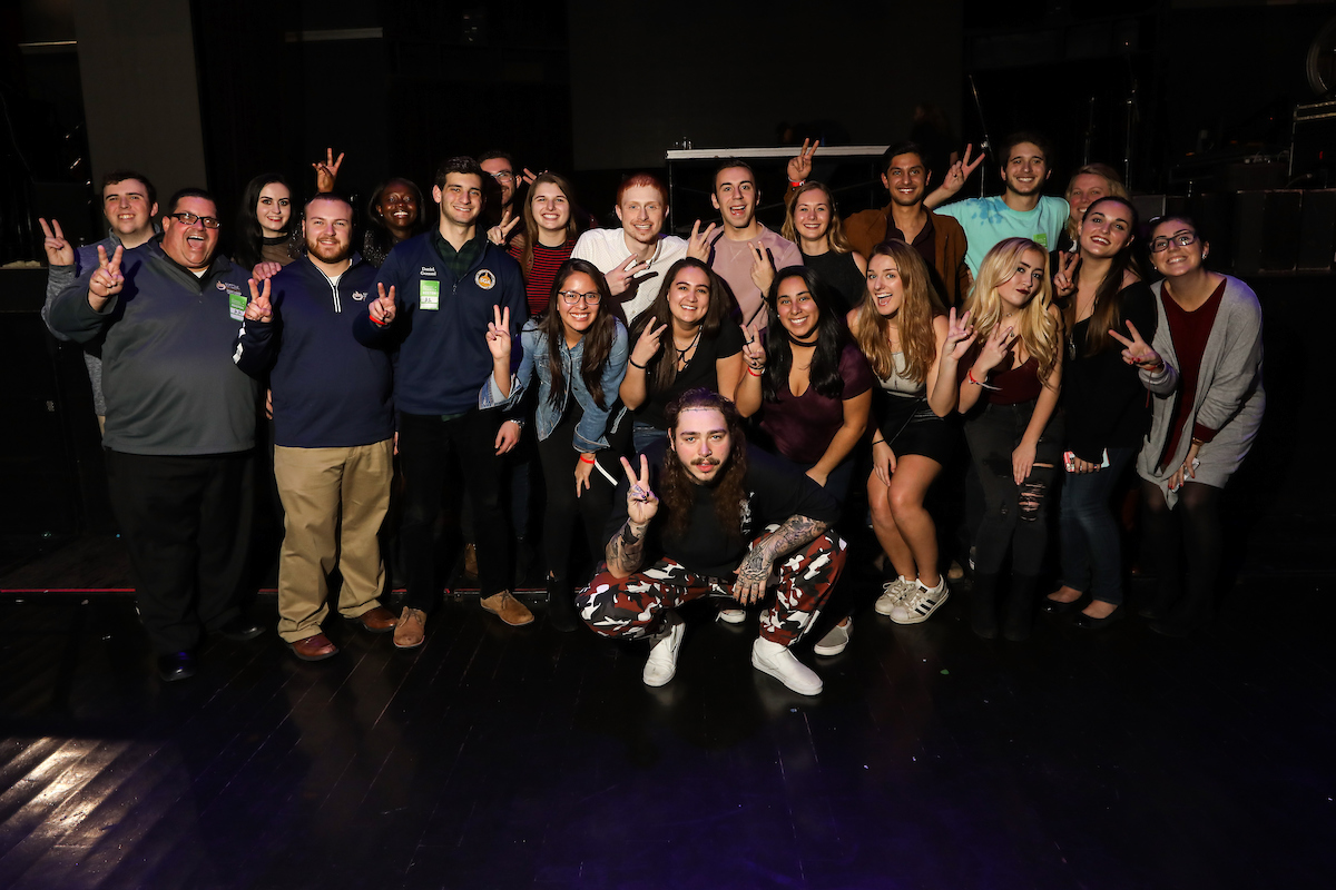 Post Malone poses with Suffolk students following the Winter Concert at the Royale Nightclub in Boston.