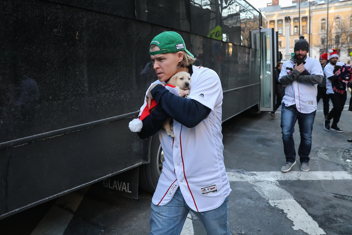 The Boston Red Sox visited Suffolk students with puppies the day before final exams begin.