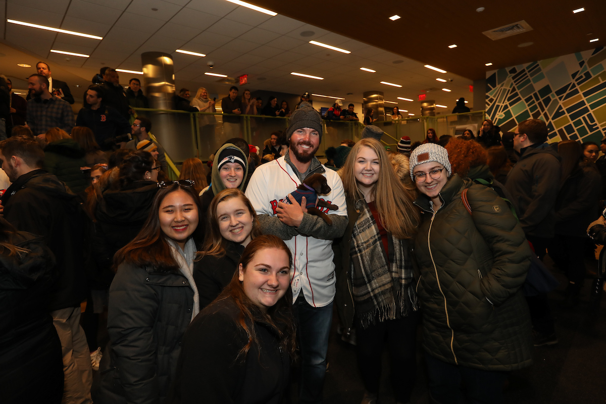 The Boston Red Sox visited Suffolk students with puppies the day before final exams begin.