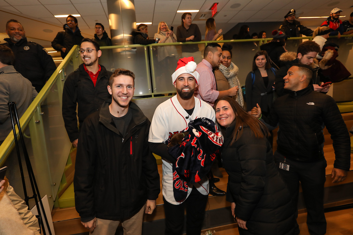 The Boston Red Sox visited Suffolk students with puppies the day before final exams begin.