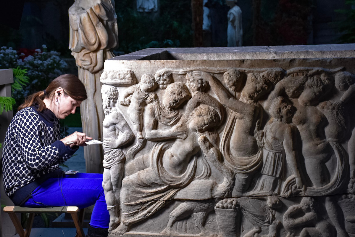 A woman cleans a sculpture display at the Isabella Stewart Gardner Museum in Boston's The Fens neighborhood.