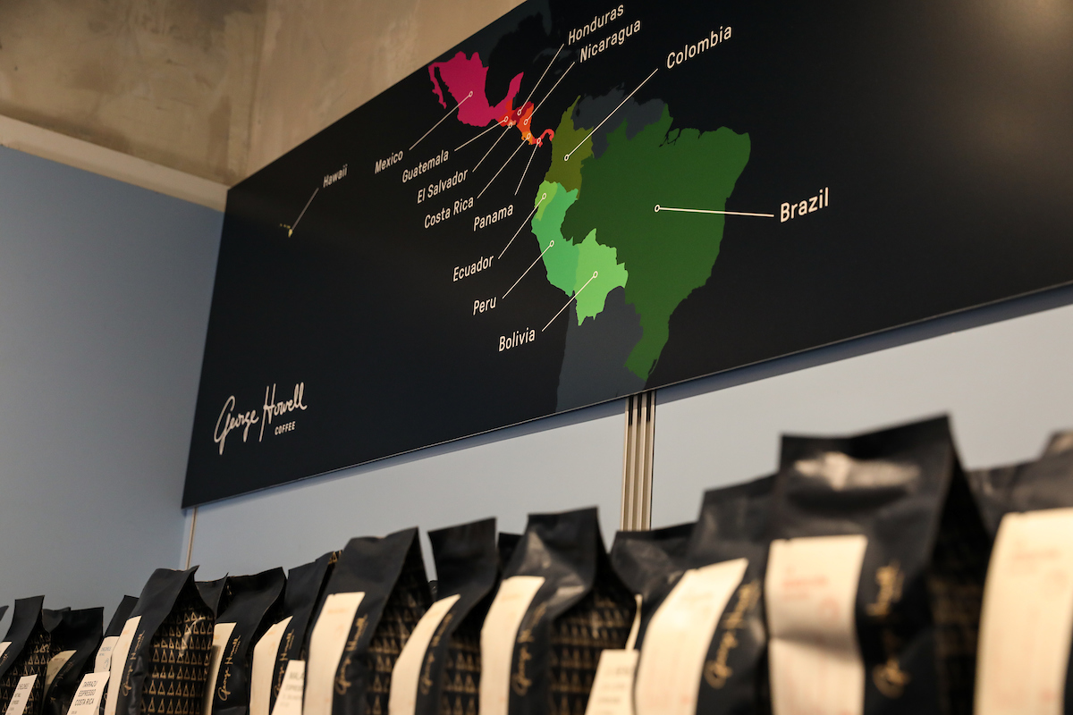 Suffolk students work with Boston-based artisanal coffee roaster George Howell during an experiential marketing class.