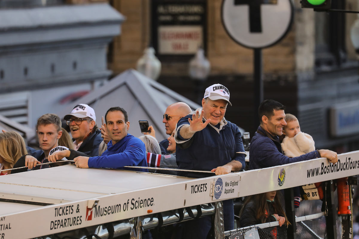 Bill Belichick rolling through Suffolk University campus while standing in Duck Boat during victory parade. 
