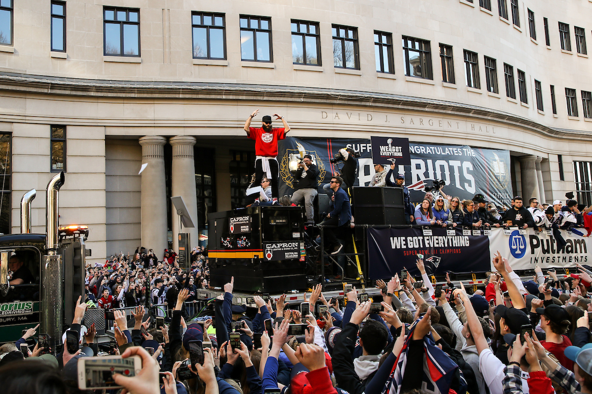 Edelman pumping up the crowd in front of the Suffolk building at the Patriots Parade.