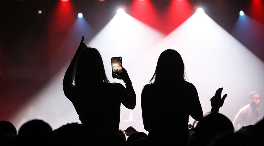 Suffolk students take pictures at the Tory Lanez concert