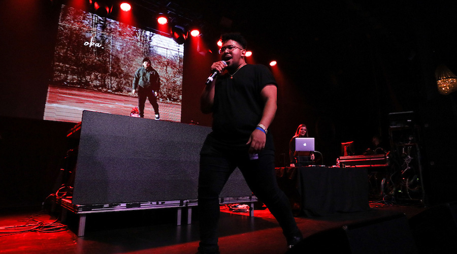 Suffolk student rapping at university concert