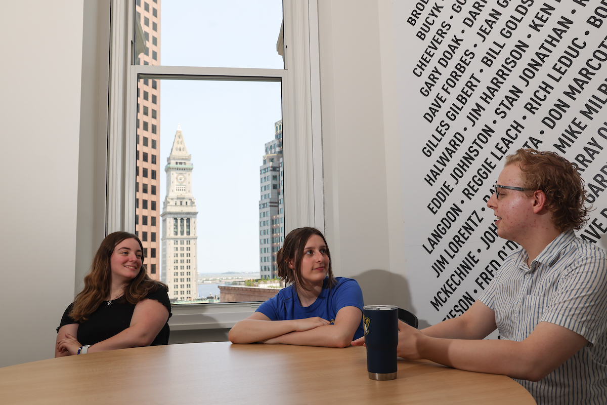 Suffolk student Morgan sits with friends in the One Court Street residence hall.