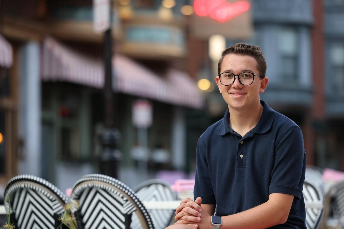 Suffolk student Stephen poses for a portrait in Boston's North End neighborhood.