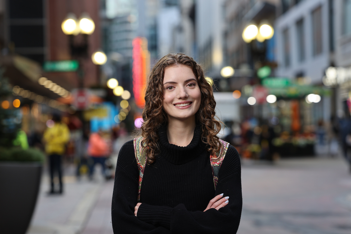 Suffolk student Grace poses for a photo on Washington Street in downtown Boston.