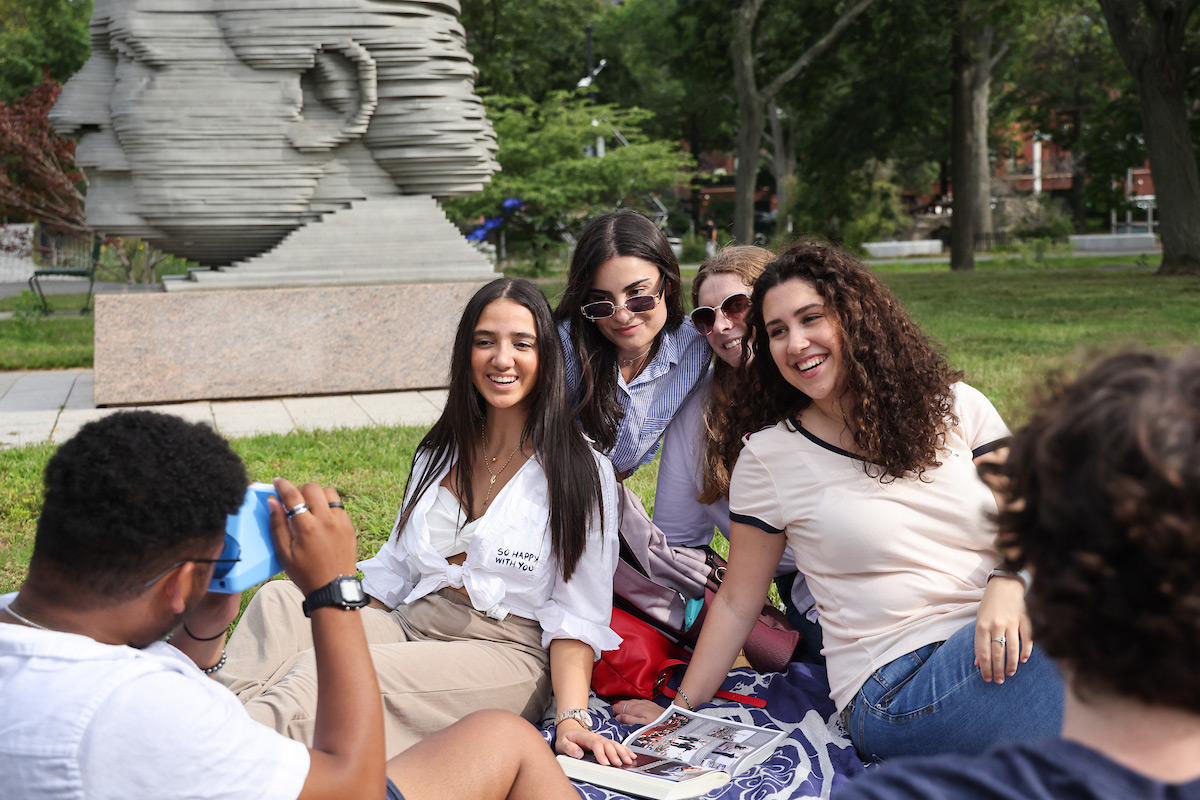 Suffolk students pose for a photo while enjoying the Esplanade in Boston.
