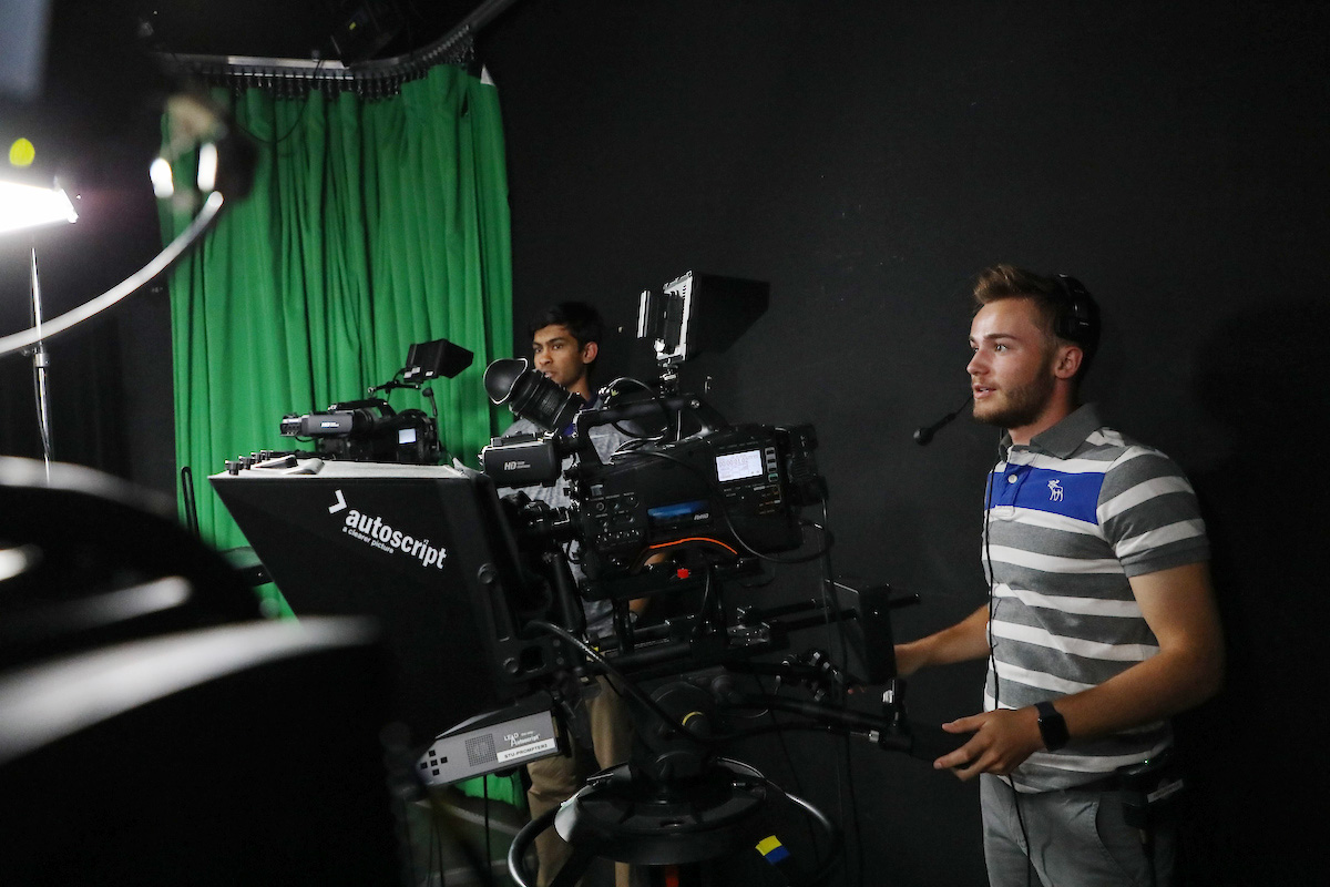 Suffolk student Hunter operates a camera in Studio 73 in Boston.