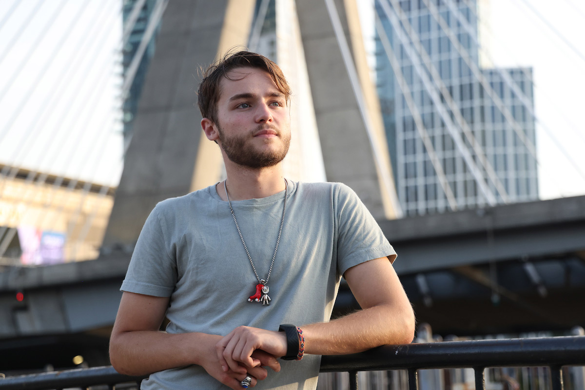 Suffolk student Hunter poses for a photo near the Zakim Bridge in Boston.