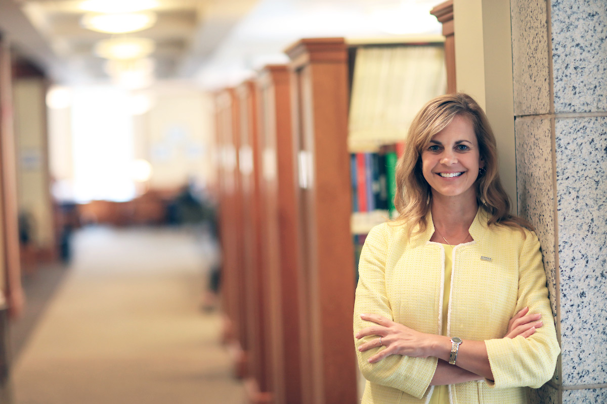 Suffolk faculty member Tracy Riley poses for a photo in the Sawyer Library.