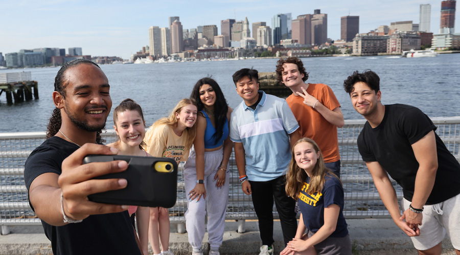 Suffolk students gather for a photo on the East Boston waterfront.