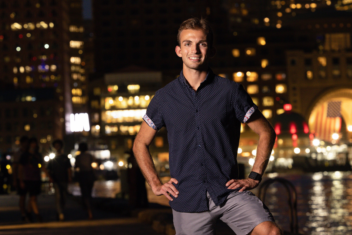 Suffolk student Nic poses for a portrait in Boston's Seaport.