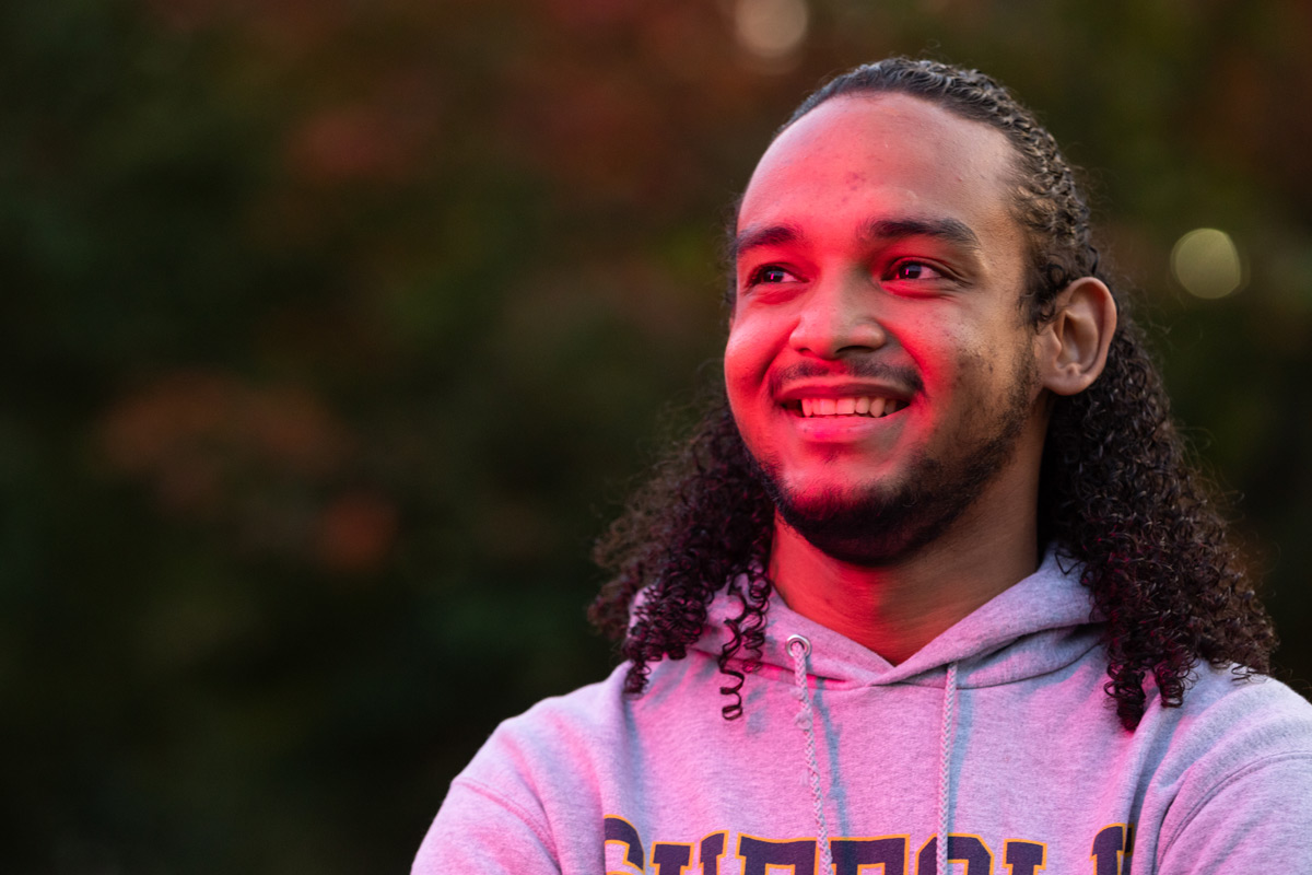 Suffolk student Omar poses for a portrait on Boston Common.