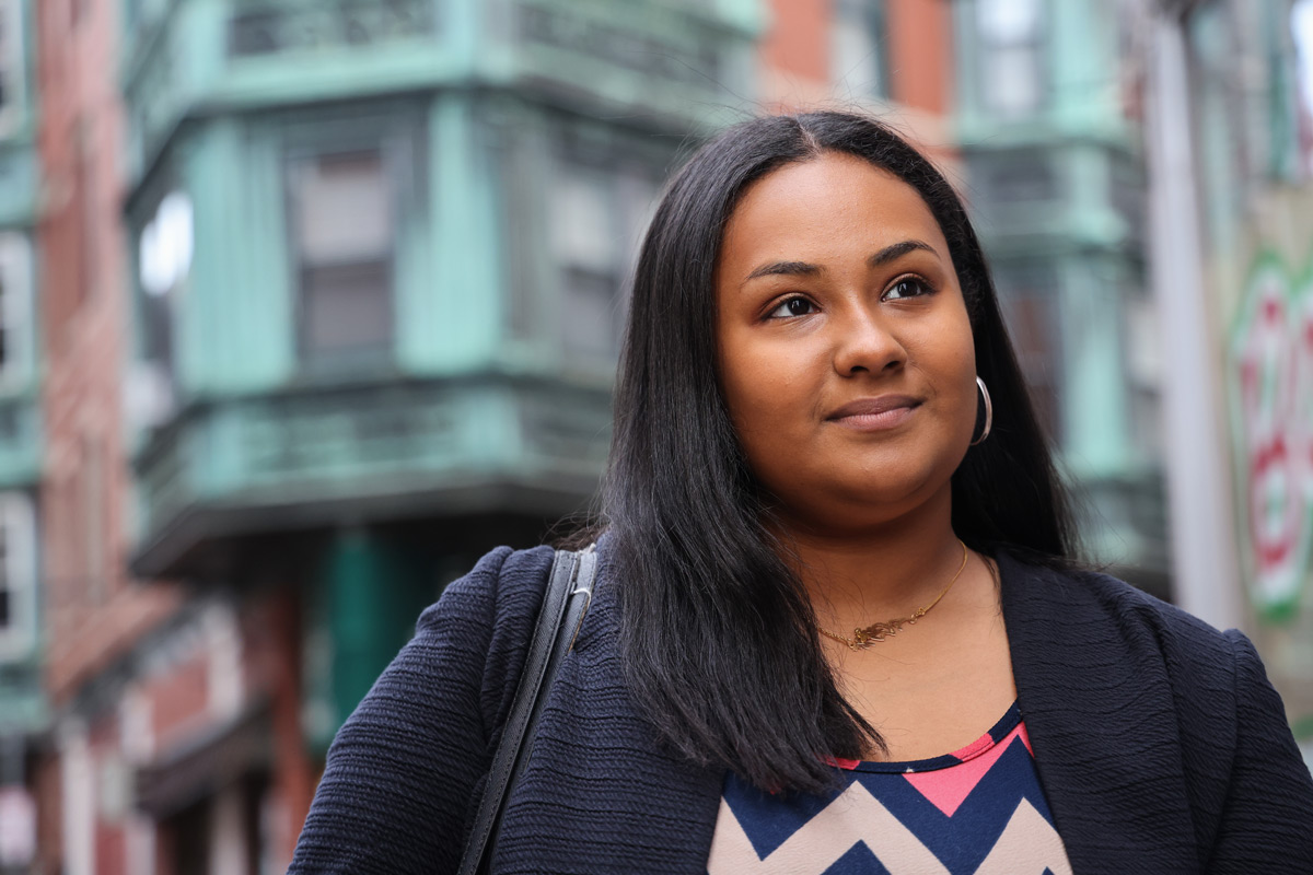 Suffolk alumnae Khadija poses for a portrait in Boston's North End.