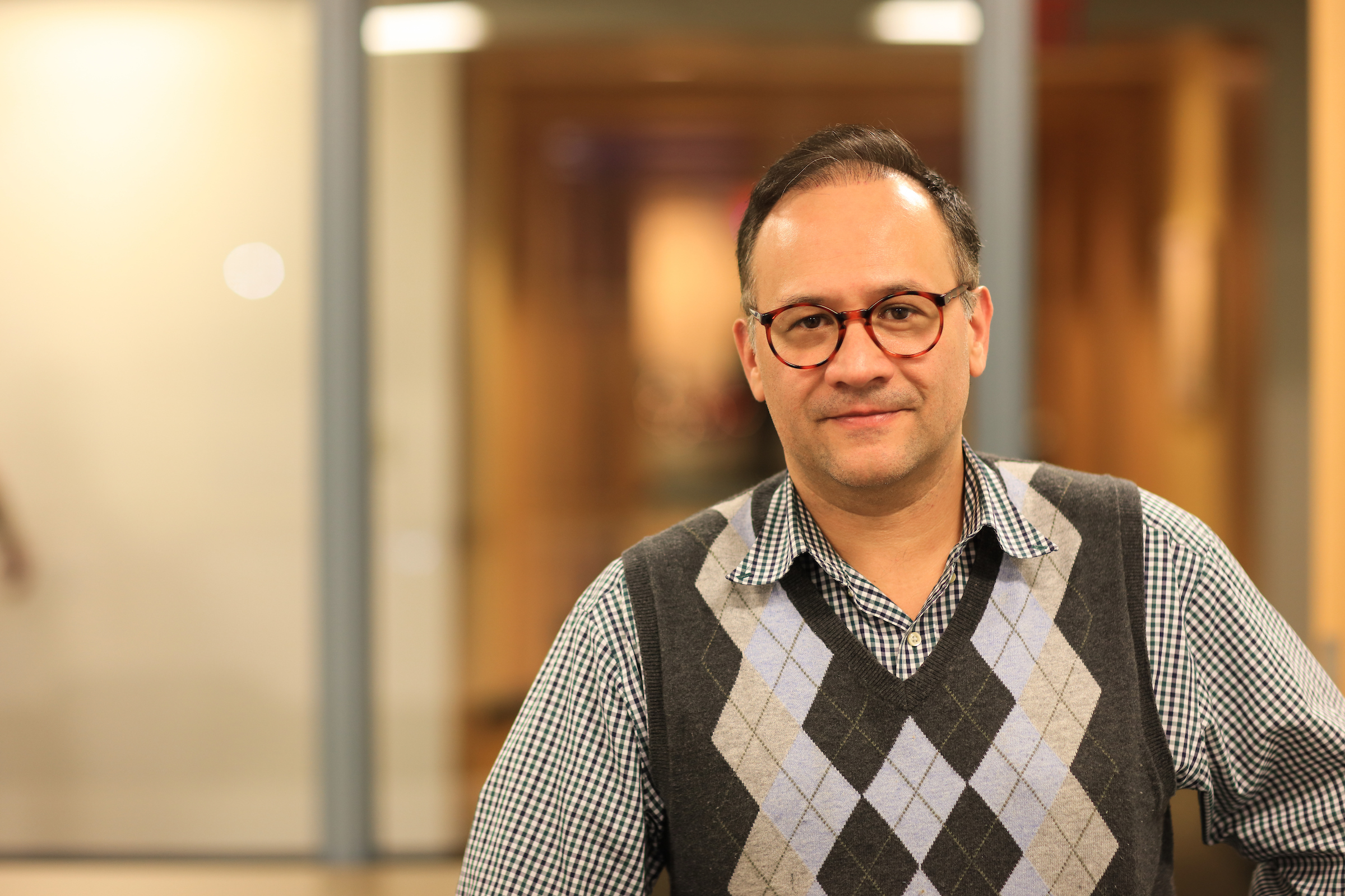 Professor of Government Roberto Dominguez poses for a photo. 