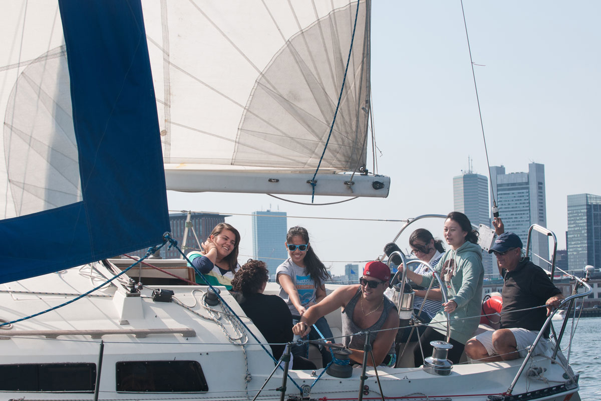 Suffolk Journey students sailing a boat in Boston Harbor in 2012.