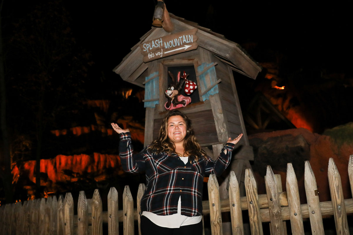 Suffolk Journey student alumna Jess DiLorenzo posing in front of Splash Mountain, the Disney ride for which she now works.