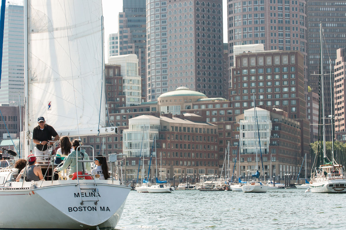 Suffolk Journey students listening to the sailing instructor during their lesson on the Boston Harbor in 2012.