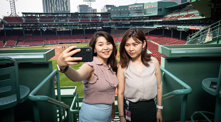 Suffolk students taking a selfie at Fenway Park