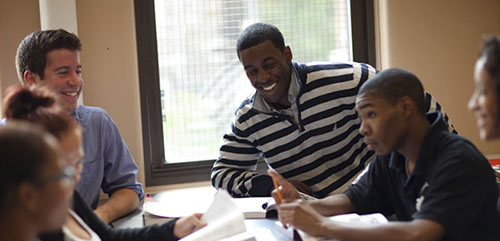 Marshall-Brennan Fellows work with teachers and students from the Jeremiah E. Burke High School