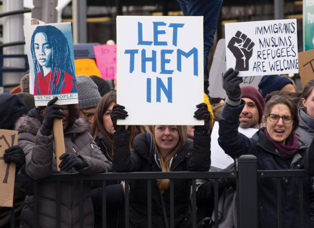 Protestors holding up signs