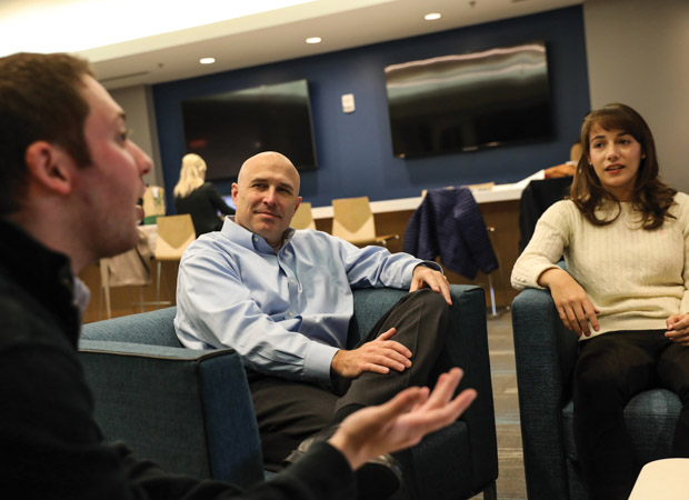 Liberty Mutual's Robert Taylor (above, center) with Suffolk Law students