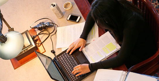 Person using laptop.