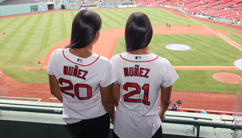 Suffolk students Evelyn and Emely Nunez at their special commencement ceremony at Fenway Park.