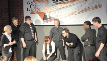 Seriously Bent doing improve at the Chicago Improve Festival, all wearing black