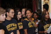 New students gathering in black Suffolk University t-shirts 