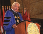 President David J. Sargent speaking at pedestal 