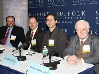 Robert Havasy, John Kelly, John Halamka, and Thomas Sullivan speaking at a panel 