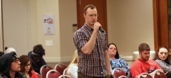 A student talking into a microphone