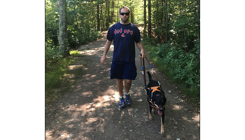 Brian Switzer with his guide dog, Intrigue